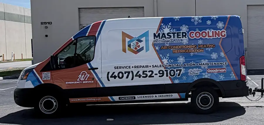 Master Cooling Mechanical service van wrapped in blue and copper, marked 24/7 Emergency Service, licensed and insured, with phone number (407) 452-9107